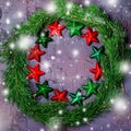 Green Christmas wreath with stars decorations on dark background. Royalty Free Stock Photo