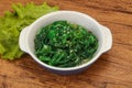 Green Chuka Seaweed Salad Isolated on White Background Top View. Wakame Sea Kelp Salat