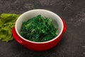 Green Chuka Seaweed Salad Isolated on White Background Top View. Wakame Sea Kelp Salat