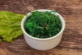 Green Chuka Seaweed Salad Isolated on White Background Top View. Wakame Sea Kelp Salat