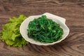 Green Chuka Seaweed Salad Isolated on White Background Top View. Wakame Sea Kelp Salat