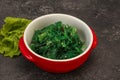 Green Chuka Seaweed Salad Isolated on White Background Top View. Wakame Sea Kelp Salat