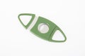 Green cigar cutter on white background Royalty Free Stock Photo