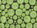 various size of green circle embroidery pattern on black linen fabric background Royalty Free Stock Photo
