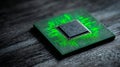 A green circuit board with a square processor on it is sitting on top of a dark wooden surface Royalty Free Stock Photo
