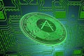 green circuit board and a valueable green ada coin from cardano crypto currency oblique