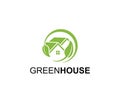 Green Circular House Icon with Leaf Symbol around isolated on White Background Royalty Free Stock Photo