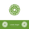 Green circular logo composed of swirling leaf shapes in a spiral pattern. The design Royalty Free Stock Photo