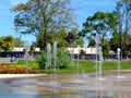 green city park with water fountain, trees and colorful flowers Royalty Free Stock Photo