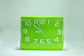 Green alarm clock analog tecnology on white background