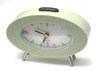 Green clock on white