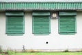 Green closed window metal roller shutters at shop Royalty Free Stock Photo