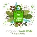 Green Cloth bag with Say no to plastic bags word on leaves background