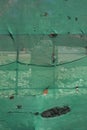 Green cloth with countable holes and stone visible through transparent cloth Royalty Free Stock Photo