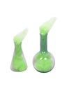 Green cloudy research beakers