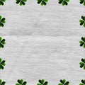 Green clover border, frame on linen fabric canvas background.