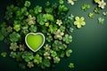 Green clover leaves and green heart laid on a green plate. Free space for text.