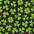 Green clover meadow with ladybirds pattern on dark