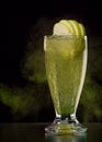 Green cocktail with apples and ice