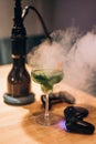 Green cocktail, hookah and games Royalty Free Stock Photo