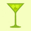 Green cocktail with ice cubes in a martini glass. Refreshing liquid. Tequila drink Royalty Free Stock Photo