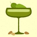 Green cocktail with leaves, cream, almonds. Grandmas Garden in margarita glass