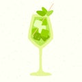 Green cocktail with leaves and ice cubes. Cold soft liquid in wine glass