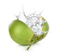 Green coconut with water splash isolated on white background.