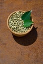 Green coffee beans in wooden bowl Royalty Free Stock Photo