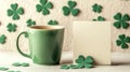Green Coffee Mug Beside Blank Note Card And Shamrocks Royalty Free Stock Photo