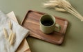 Warm Morning Coffee Mug on a Wooden Tray with Wheat Stalks and Fabric Texture, AI generated Royalty Free Stock Photo
