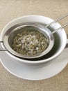 Green coffee in tea strainer Royalty Free Stock Photo
