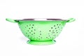 Green colander on white backgound Royalty Free Stock Photo