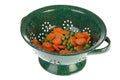 Green colander with vegetables