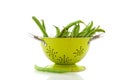 Green colander for washing French beans