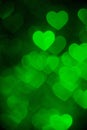 Green color heart bokeh background photo. Abstract holiday, celebration backdrop. Royalty Free Stock Photo