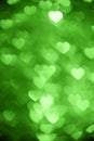 Green color heart bokeh background photo. Abstract holiday, celebration backdrop. Royalty Free Stock Photo