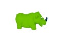 Green color miniature plastic toy of a rhino isolated on a white background