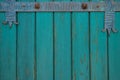 Green color old wooden doors with a forged metal Royalty Free Stock Photo