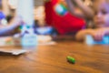 Green color pastel crayon on brown wooden table Royalty Free Stock Photo