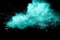 Green color powder explosion cloud on black background.Green dust splash Royalty Free Stock Photo