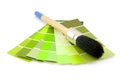 Green color samples and paint brush