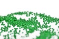 Green color seed beads scattered on a white. Abstract background Royalty Free Stock Photo