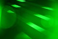 Green color spotlight rays on staircase perspective view blur effect