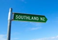 A Green color Street name signs showing the direction in the big city of Southland, New Zealand, Isolated on blue sky background. Royalty Free Stock Photo