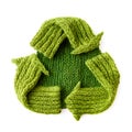 Green color waste recycling symbol made of knitwear on white background