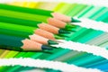 Green colored pencils and color chart