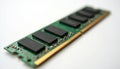 Green computer RAM module close up on white background. Black memory chips, golden contacts visible. Represents essential PC Royalty Free Stock Photo