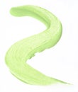 Green concealer swatch isolated over white