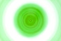 Green concentric colorful circles, abstract blurred vortex, swirl.